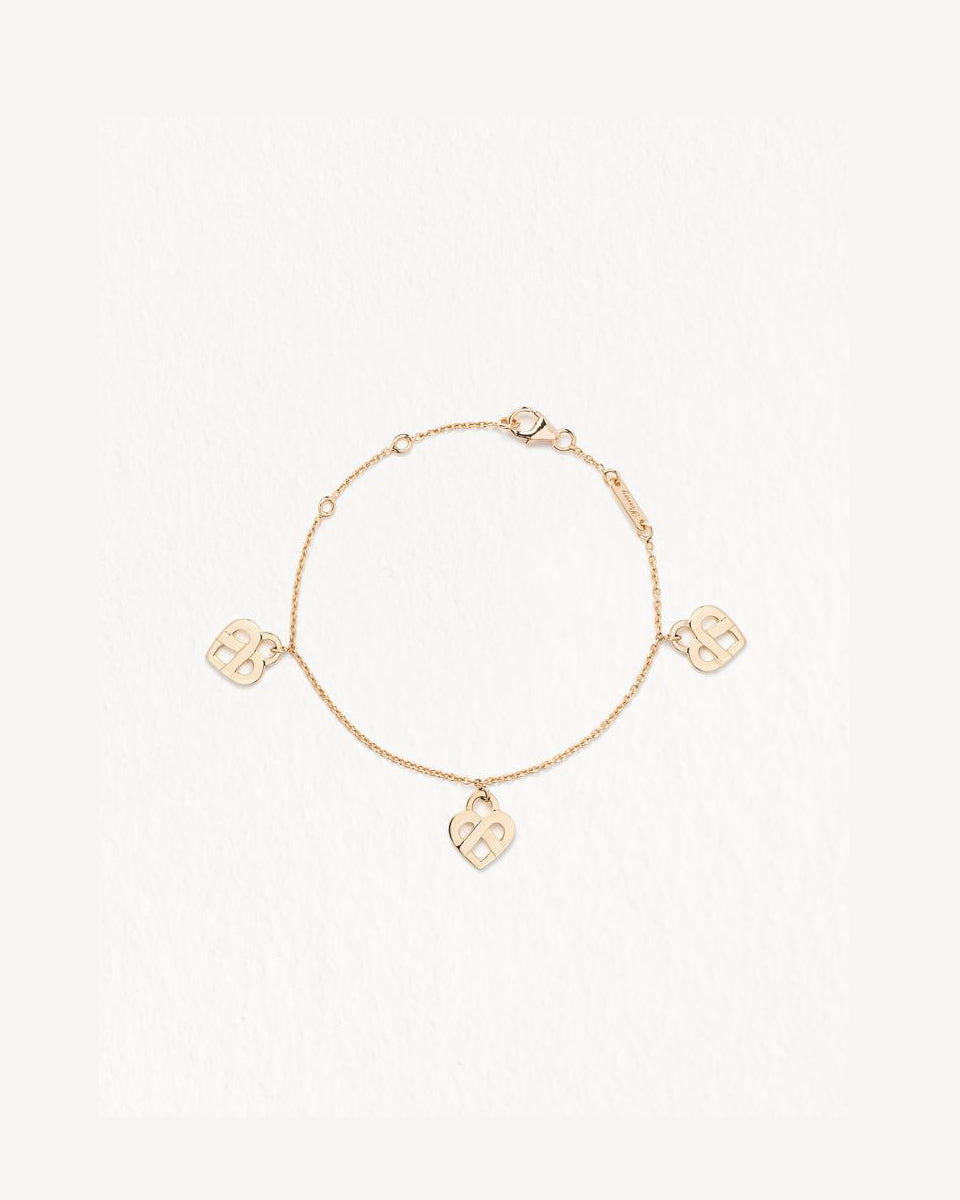 Poiray Bracelet 3  Cœurs  Entrelacé en or jaune 18 carats . Référence : 628205